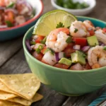 What Is Shrimp Ceviche? A bowl of shrimp ceviche with lime, onions, and tostadas