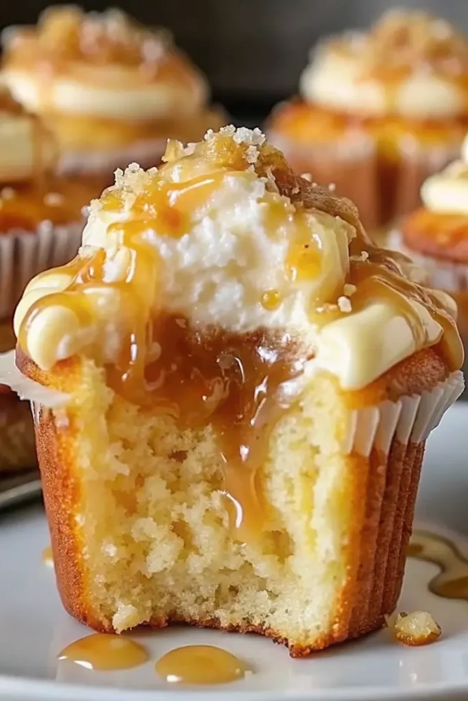 Moist Honey Peach Cream Cheese Cupcakes topped with creamy frosting and sweet honey drizzle