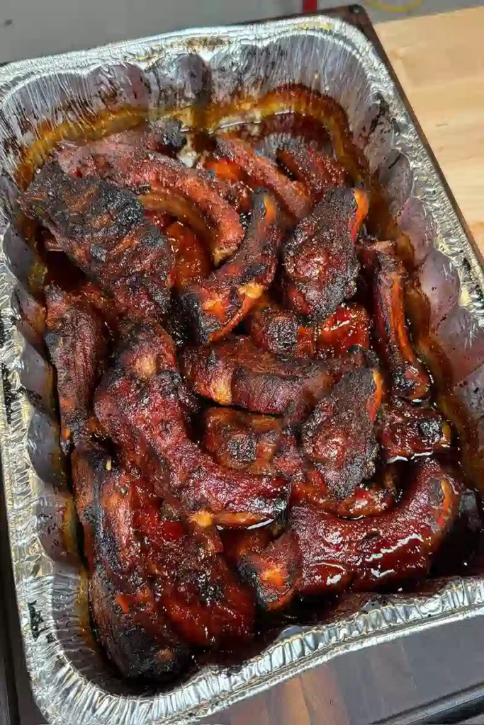 Best BBQ ribs baked until tender with sticky barbecue sauce